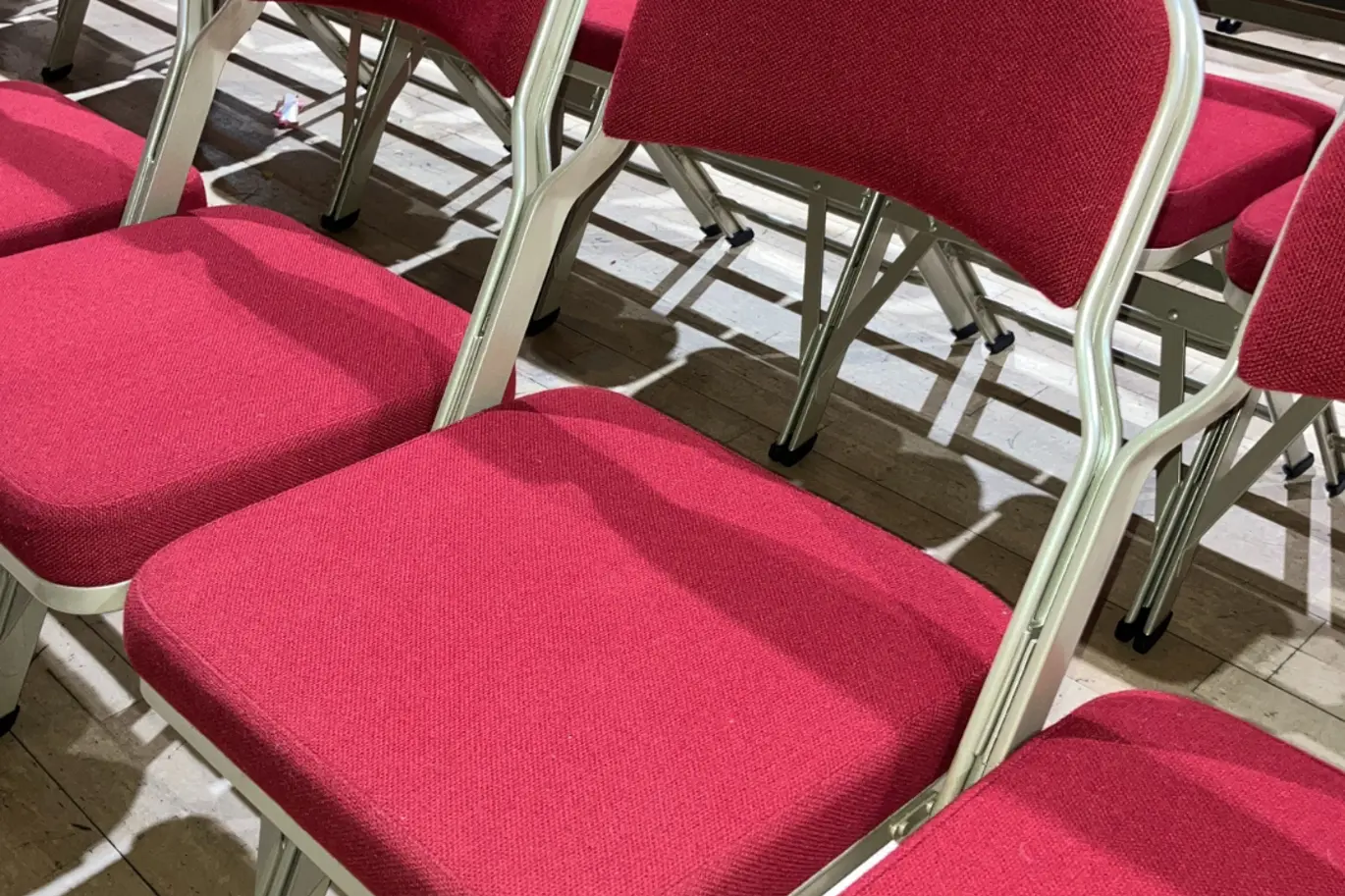 Winding wheel theatre auditorium seats.