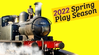 A bright yellow background with a runaway steam train passing by. The driver stands on the top.