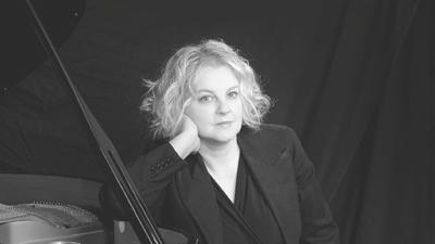 A black and white headshot of jazz singer Wendy Kirkland. 