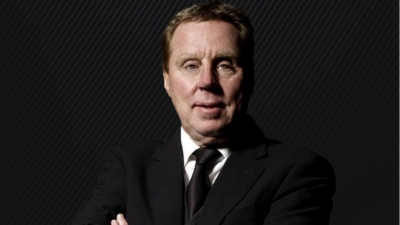 A close up of Harry Redknapp against a black background. 