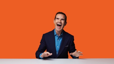 laughing man on an orange background