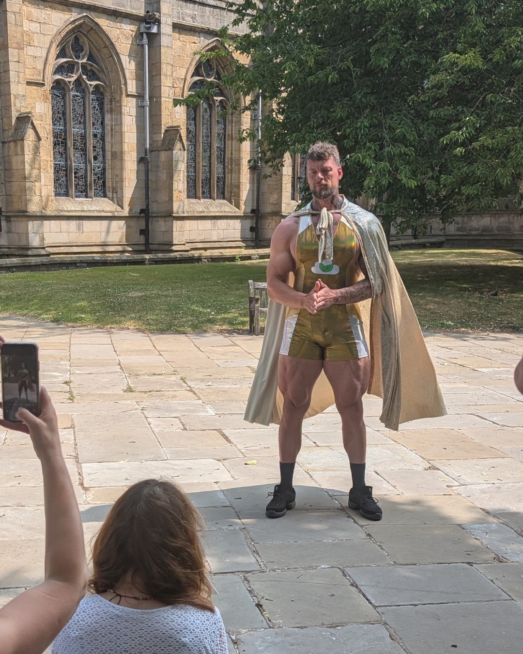 Jamie Christian stand in front of Chesterfield's Crooked Spire